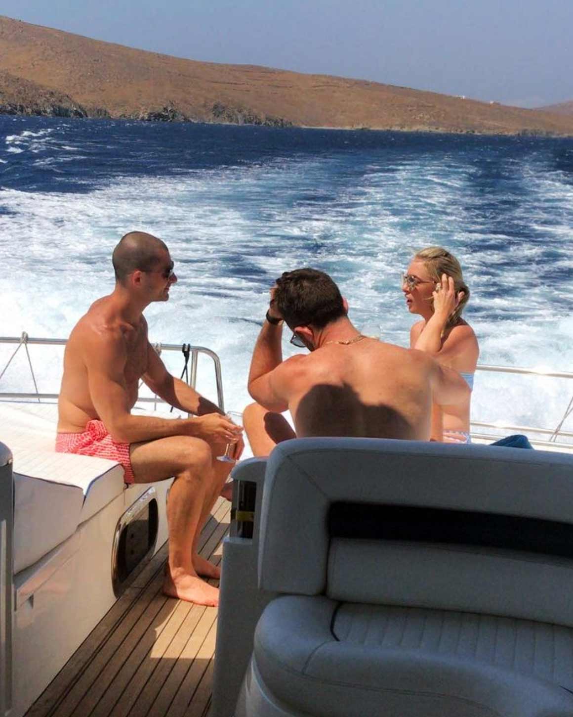 friends talking on a boat