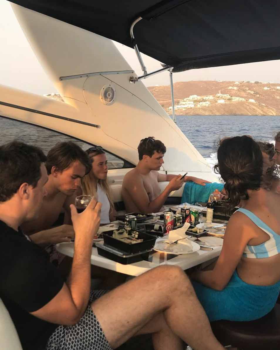group of friends enjoying diner on a boat